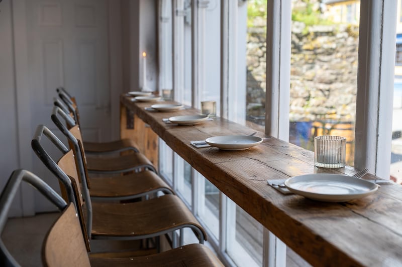 High-stool seating by the window at Saint Francis Provisions. Photograph: John Allen
