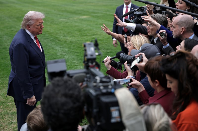 US president Donald Trump speaks to members of the media prior to a Marine One departure from the South Lawn of the White House on Friday. Photograph: Alex Wong/Getty