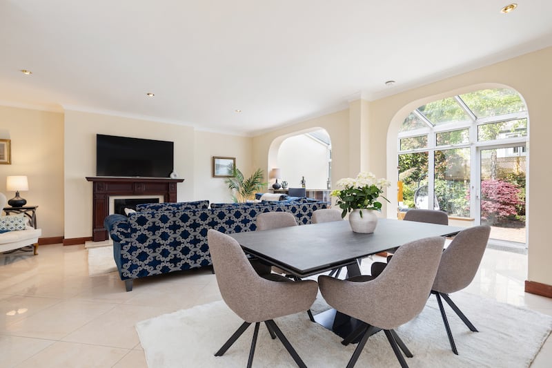 Living/dining space opens into sunroom