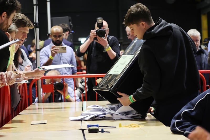 The first ballot boxes are opened at the start of counting in the Dublin Central by-election at Dublins RDS.
Photograph: Alan Betson / The Irish Times
