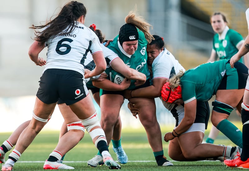 Ireland's Ellena Perry is tackled by Wales' Sisilia Tuipulotu. Photograph: Nick Elliott/Ipho