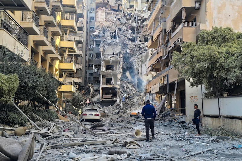People look at damage at the site of an Israeli strike in Tyre, southern Lebanon, on Thursday. Photograph: Kawnat Haju/AFP via Getty Images