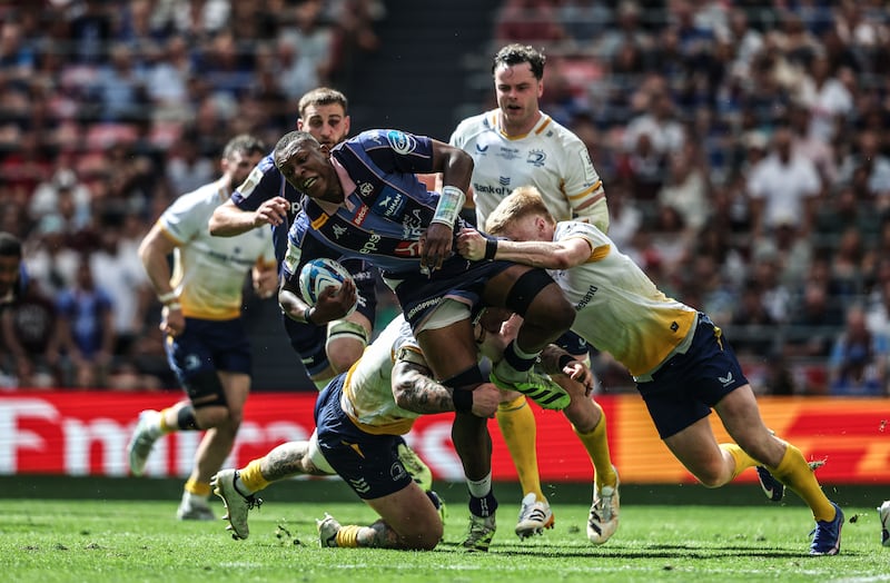 Union Bordeaux Bègles' Cameron Woki is tackled by Leinster's Andrew Porter and Tommy O'Brien. Photograph: Dan Sheridan/Inpho