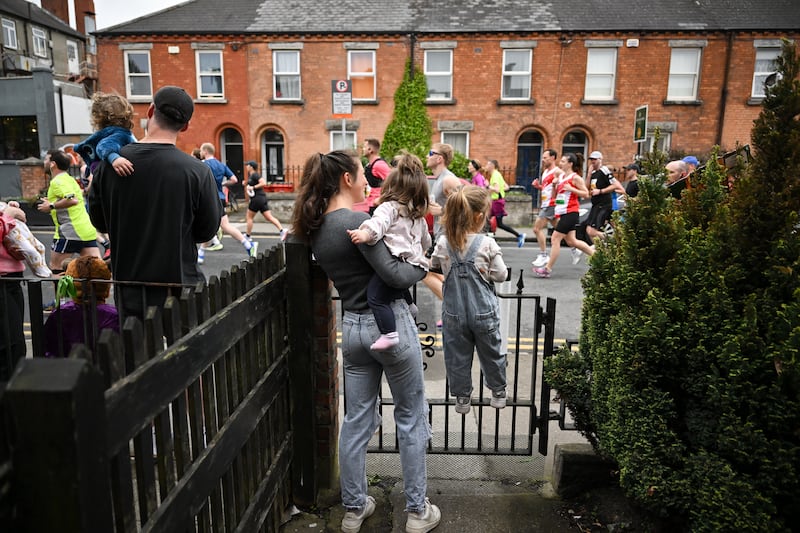 Spectators watch the runners taking part in the Dublin City Half Marathon on Sunday, May 3rd. Photograph: David Fitzgerald/Sportsfile 
