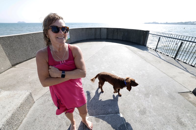 Carol Metchette and her dog Harvey at Dún Laoghaire Baths on Thursday. Photograph: Nick Bradshaw