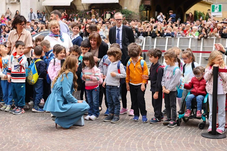 Catherine, Princess of Wales, speaks to children as she arrives at the city hall on the first day of her visit to Reggio Emilia on May 13, 2026