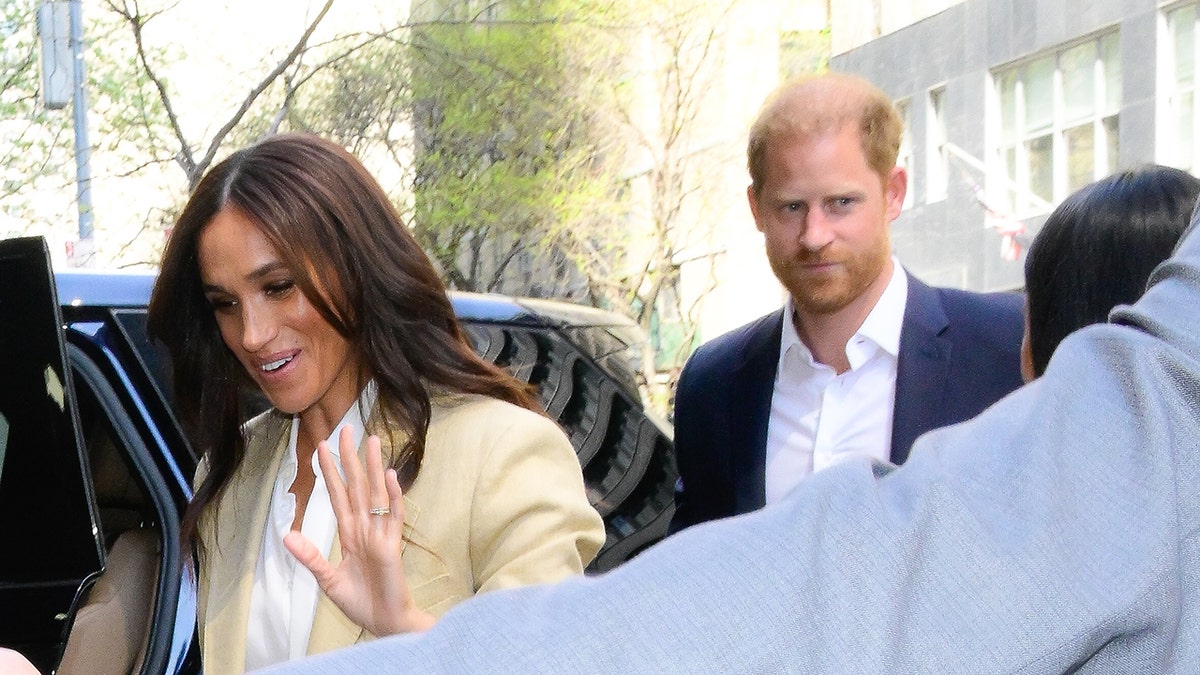 Prince Harry and Meghan Markle entering a car in New York City