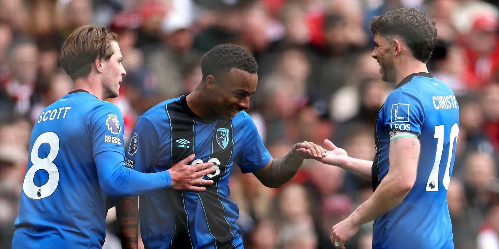 AFC Bournemouth's Junior Kroupi celebrates scoring their first goal with Alex Scott and Ryan Christie