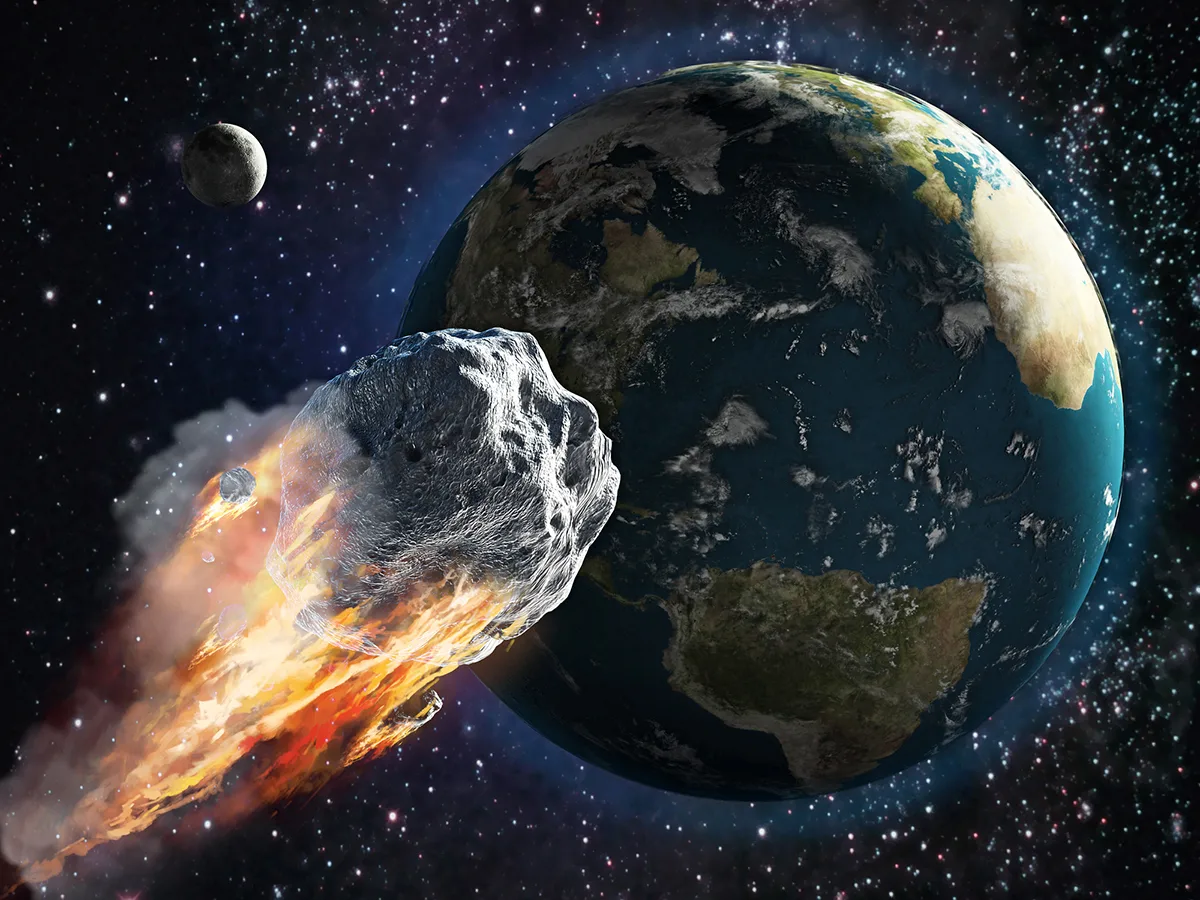 Artist's impression of an asteroid flying past Earth. Credit: adventtr / Getty Images