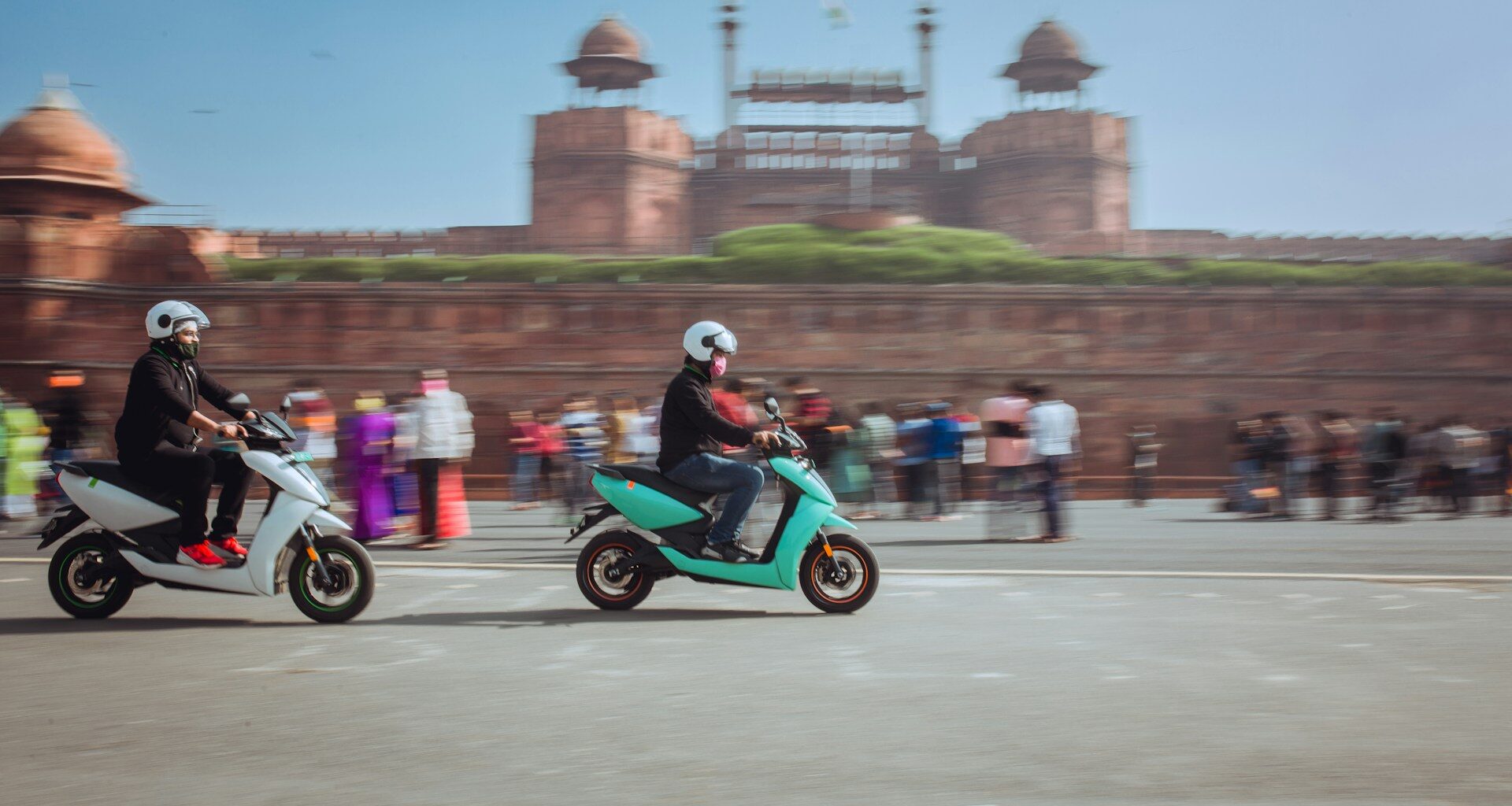 Electric scooters in front of the Red Fort, Delhi