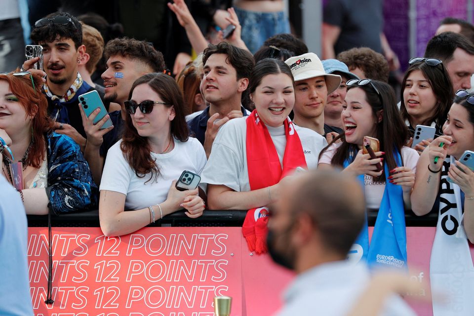 Fans celebrate at the Eurovision Song Contest's "Turquoise Carpet" event in Vienna (REUTERS/Lisa Leutner)