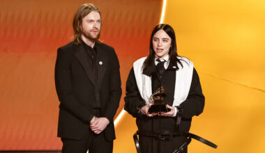 Billie Eilish on stage at the 2026 Grammys with brother FINNEAS