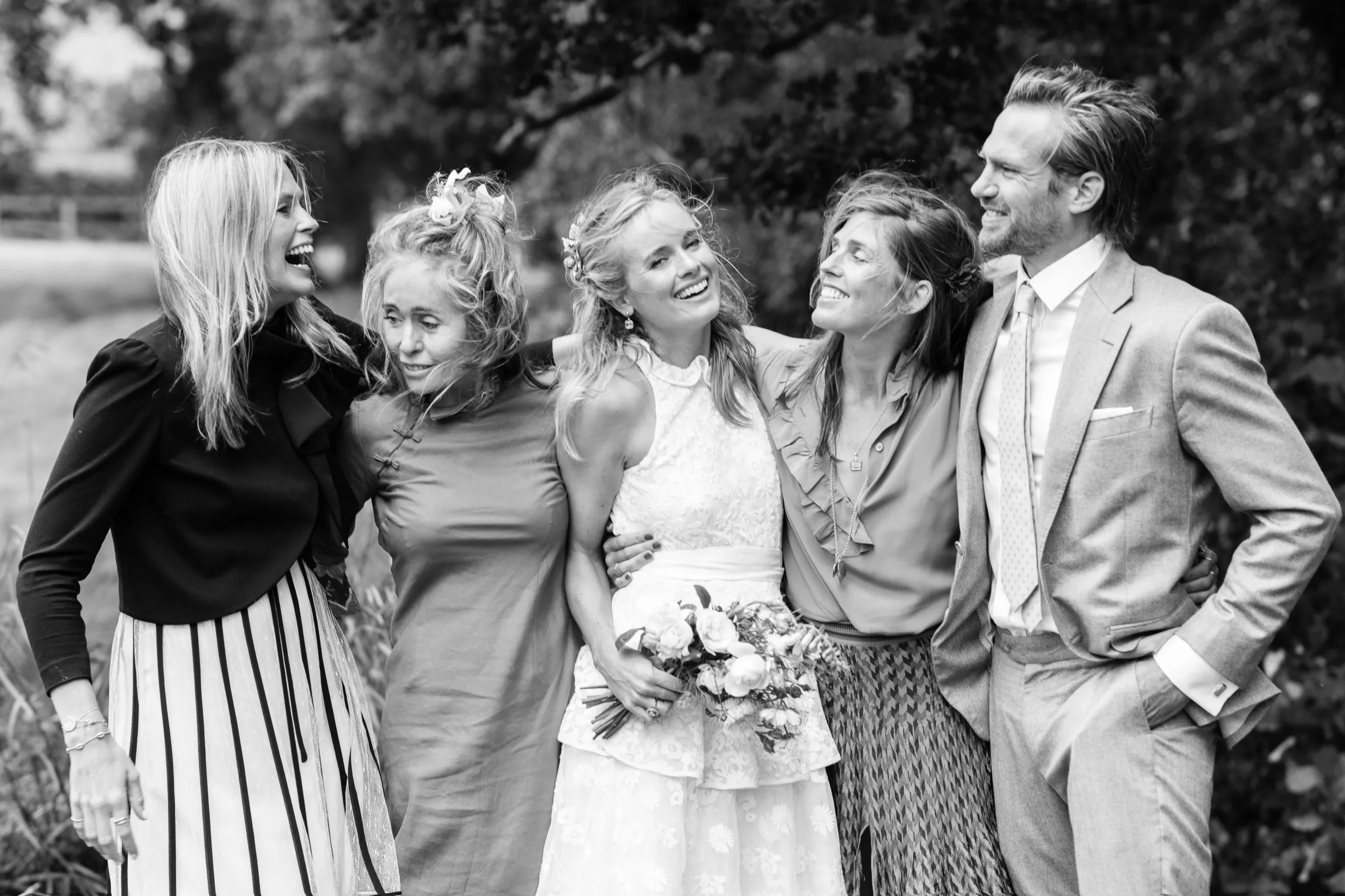 Isabella, Pandora, Cressida, Georgiana, and Jacobi smiling at Cressida’s wedding.