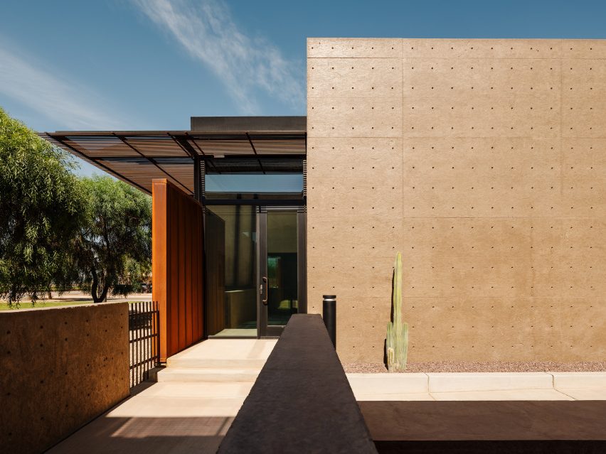 A trellis formed of steel reinforcing bars shades clerestory windows from the desert sun