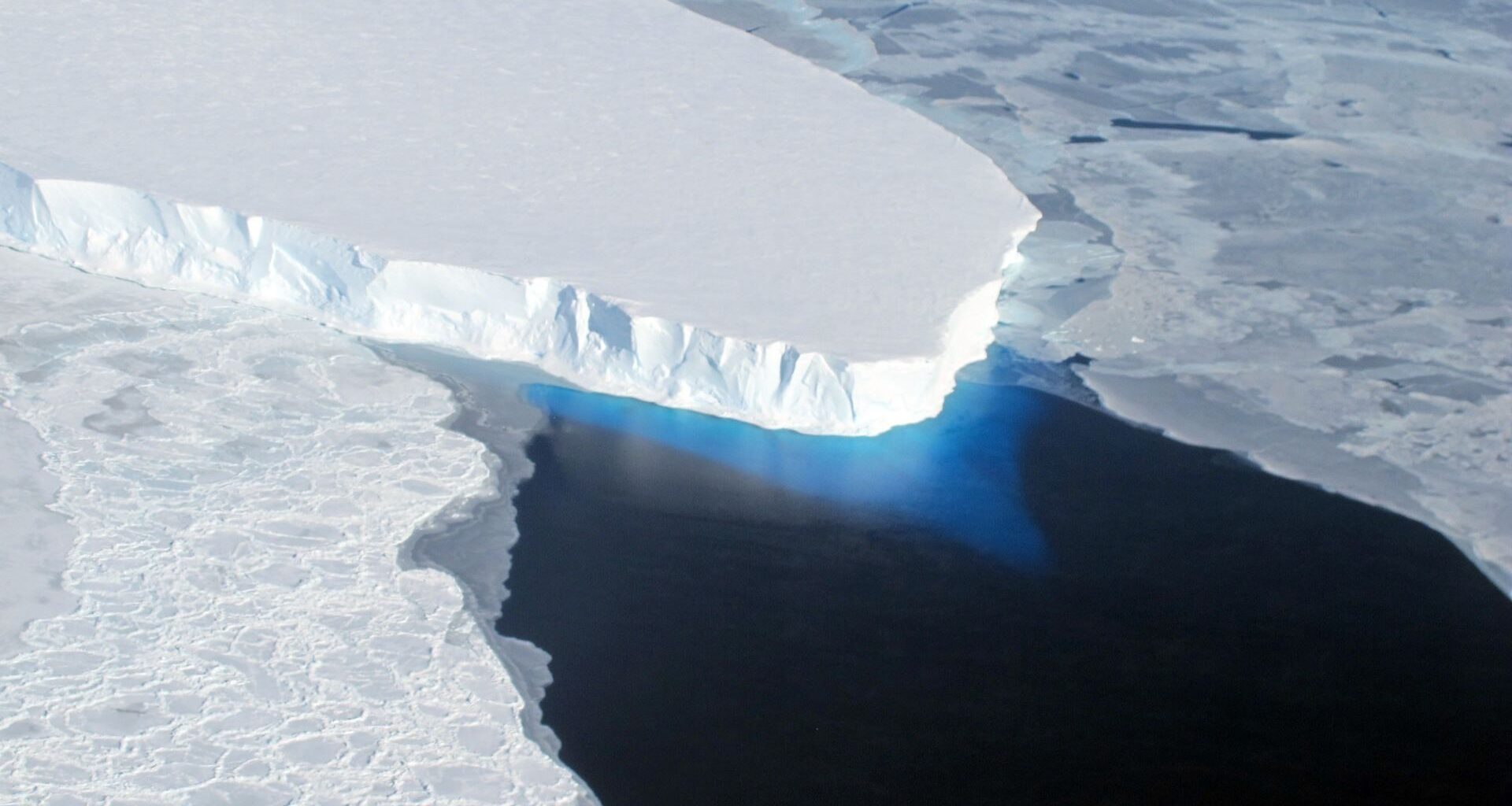 A view from above of a large glacier in the ocean