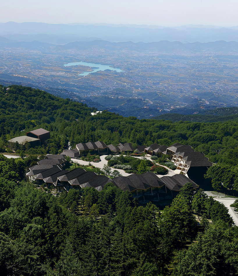 fragmented timber volumes compose forested mountain housing by arup in albania - 1