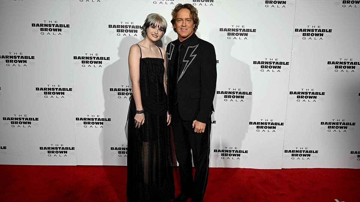 Dannielynn Birkhead and Larry Birkhead standing at the Kentucky Derby gala in Louisville, Kentucky