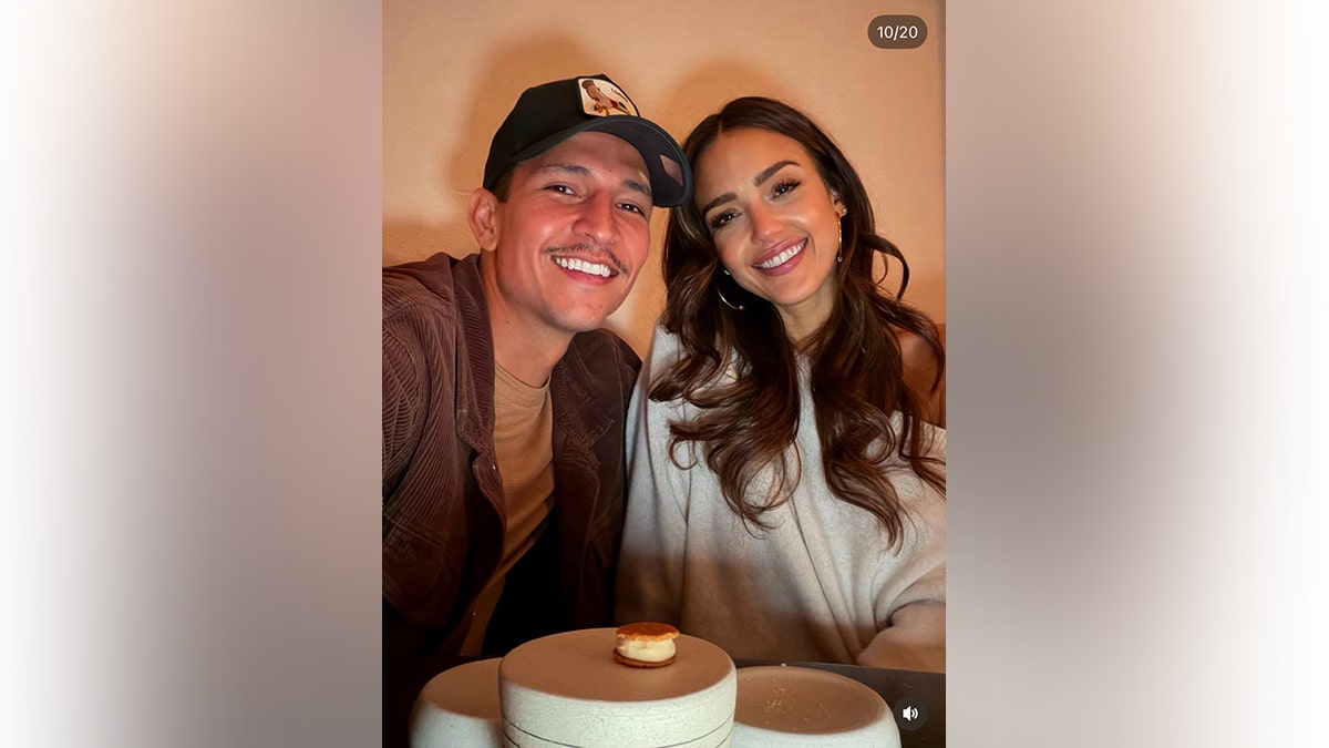 Jessica Alba and Danny Ramirez smiling together