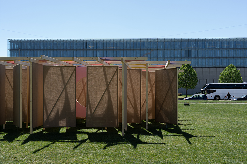 jute fabric walls and shifting pathways form delulu interactive labyrinth - 3