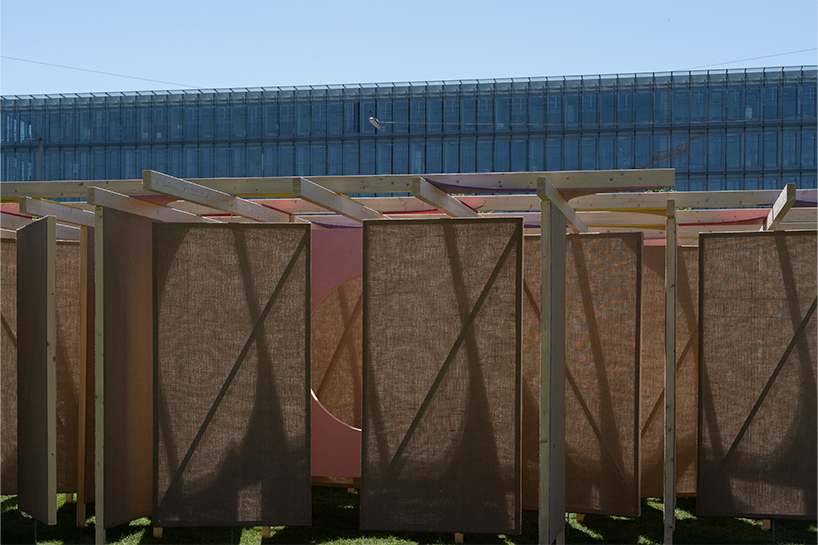 jute fabric walls and shifting pathways form delulu interactive labyrinth - 4