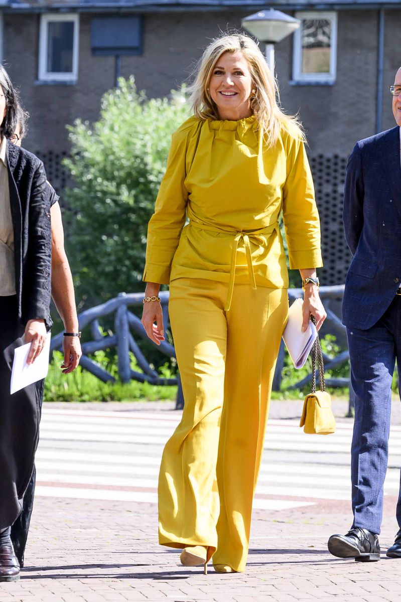 Queen Máxima of the Netherlands embraced monochromatic dressing in a vibrant yellow ensemble during her visit to KITLV in Leiden.
