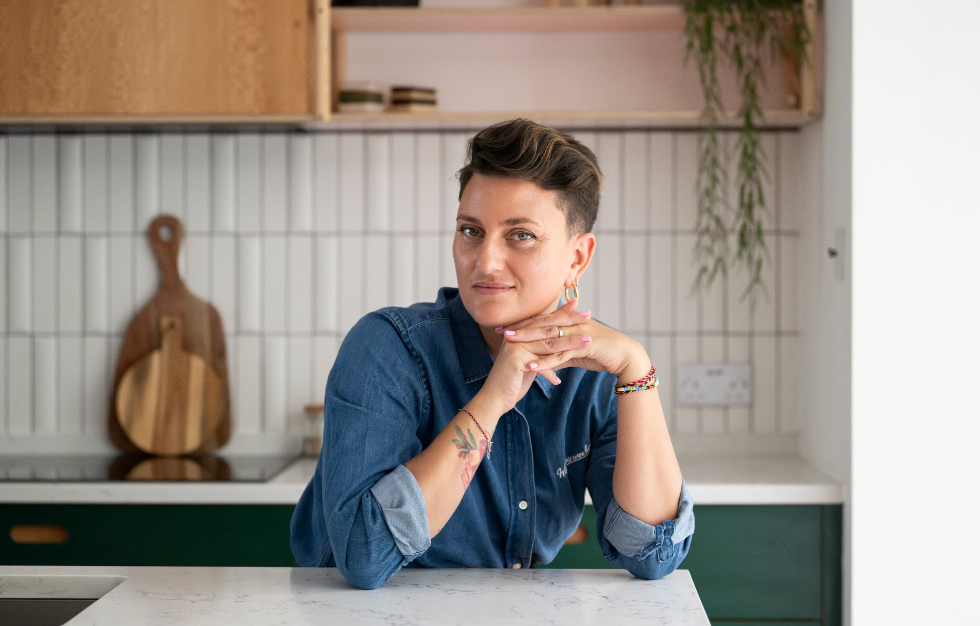 woman in a kitchen in a denim shirt