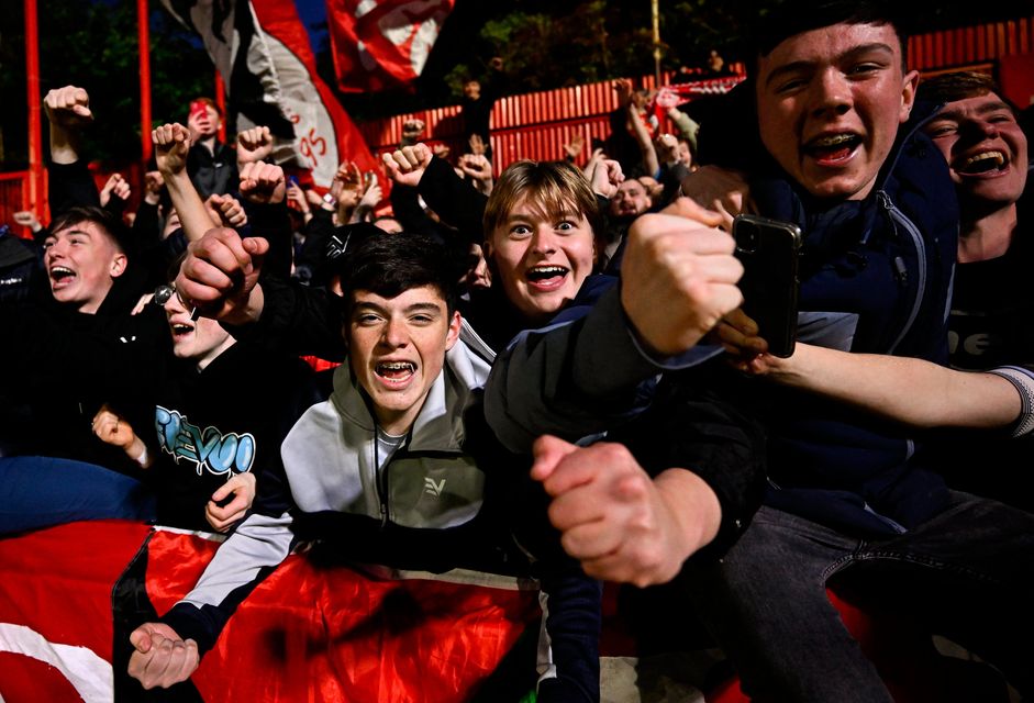 Shelbourne supporters celebrate after their side's victory at Richmond Park. Photo: Seb Daly/Sportsfile