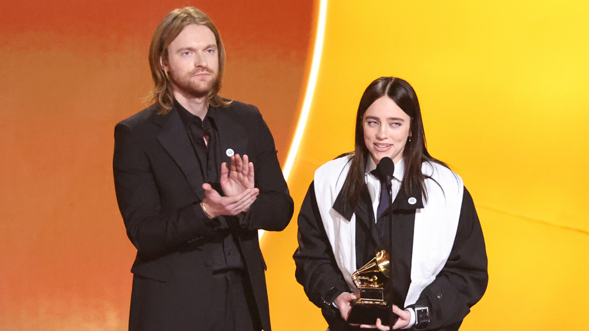 Finneas and Billie Eilish standing together at the 68th GRAMMY Awards in Los Angeles