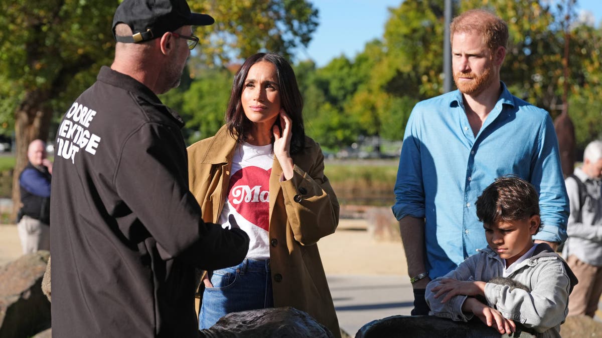 Meghan, Duchess of Sussex, and Prince Harry, Duke of Sussex, walking on the Scar Tree Walk in Melbourne