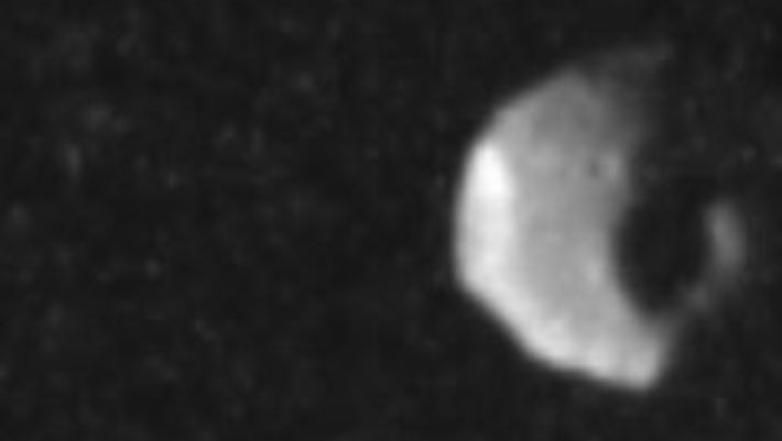 Juno Snaps Rare Close-Up of Jupiter’s Shadowy Moon Thebe