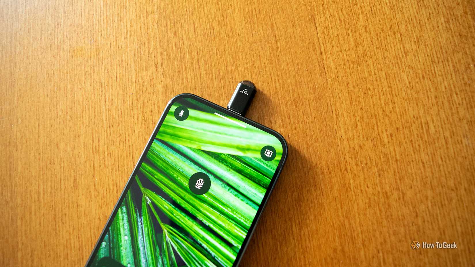 An IR Blaster Adapter plugged into a Pixel 10 Pro.