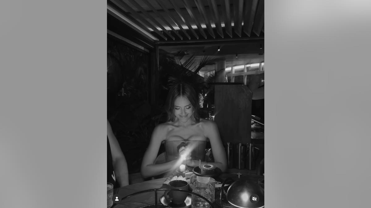 Jessica Alba looking at her birthday cake.