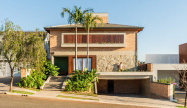 lima house carves open living spaces around a tropical garden in são paulo