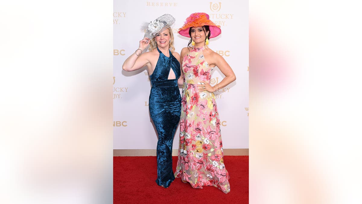 Melissa Joan Hart and Danica McKellar standing together at Churchill Downs during the Kentucky Derby