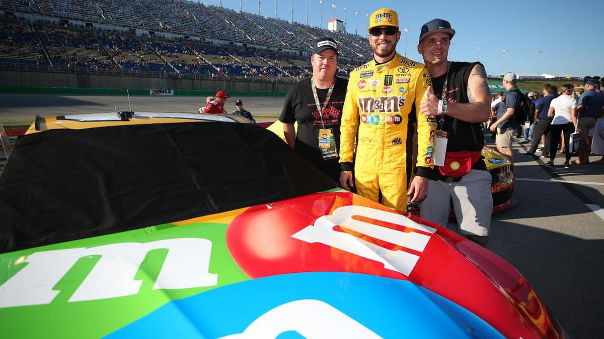 Kyle Busch driving a race car at Kentucky Speedway