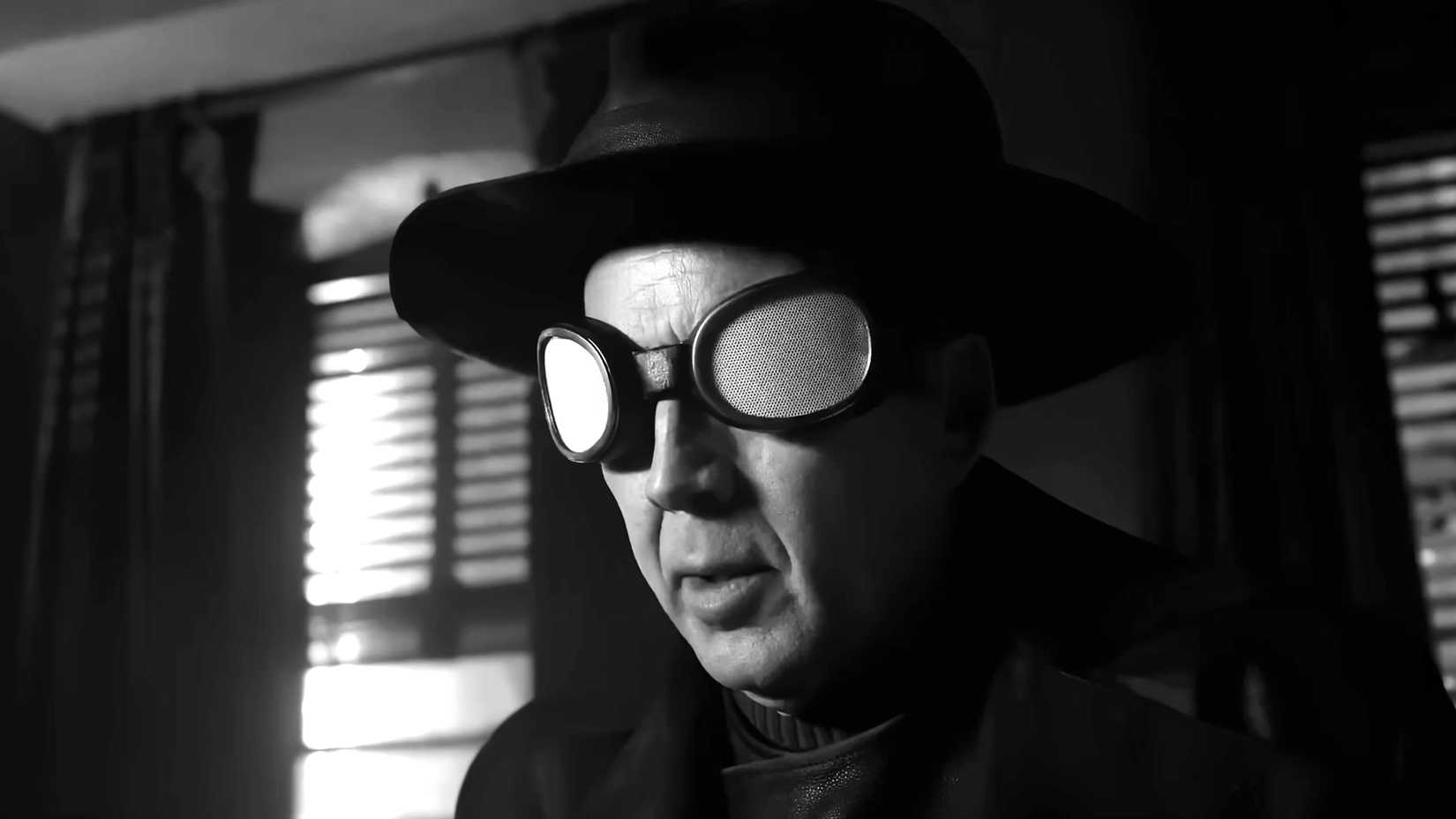 Nicolas Cage's Ben wearing his goggles and fedora in Spider-Noir