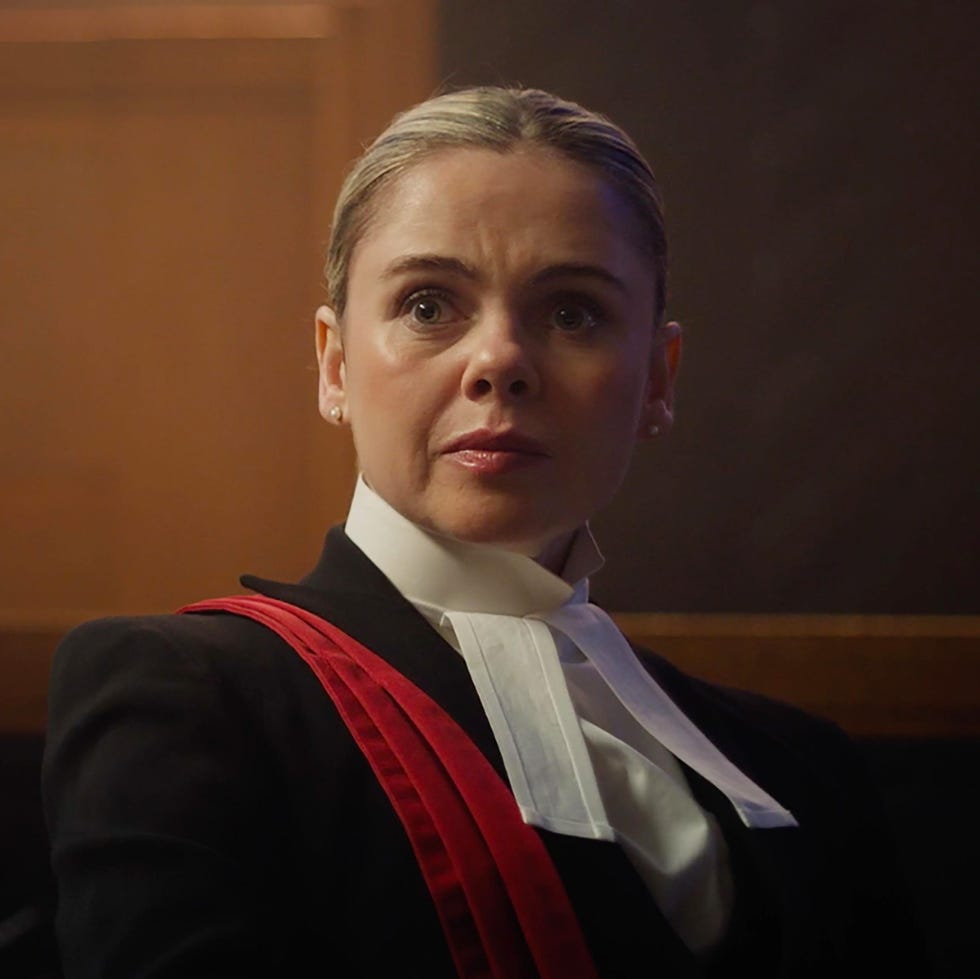 person in legal attire in a courtroom setting person in legal attire in a courtroom setting