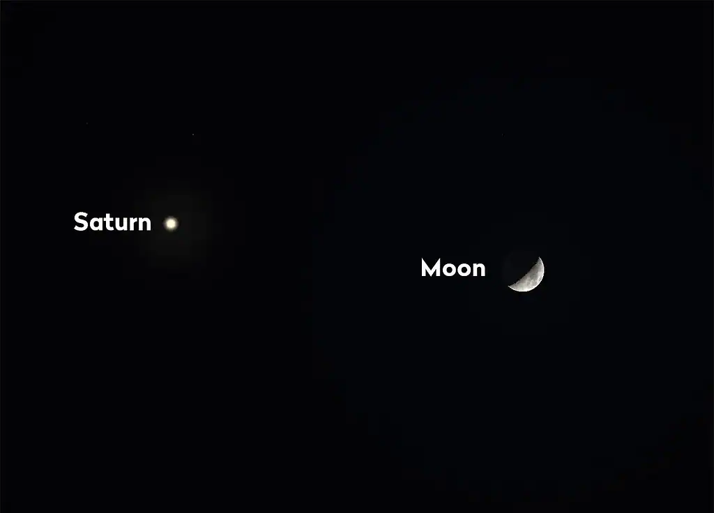 Saturn and Moon visible in the dark night sky with minimal light pollution.
