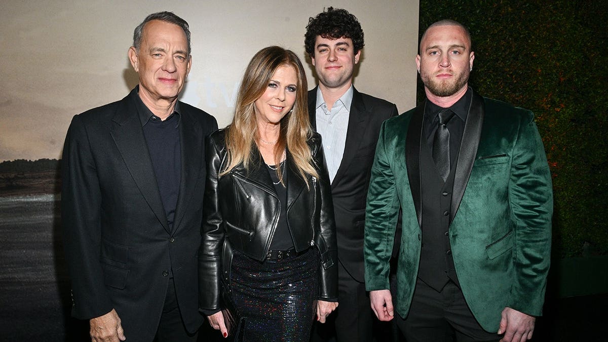 Tom Hanks and Rita Wilson standing with their sons Truman Hanks and Chet Hanks at a premiere event
