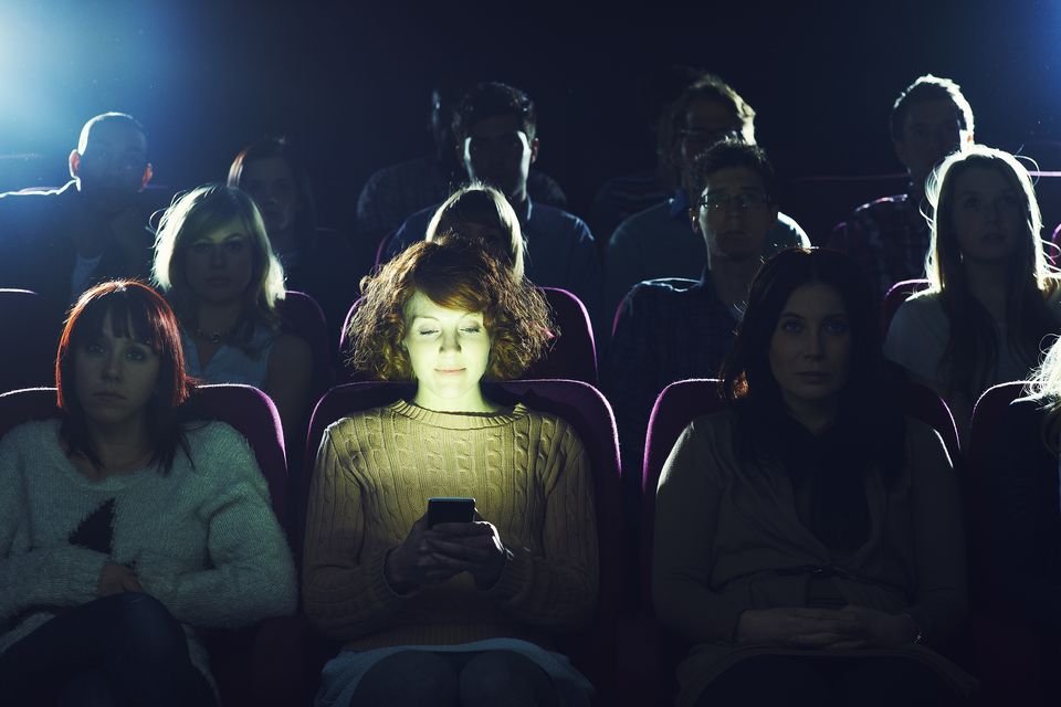 Please don't whip out your phone in the cinema or theatre. Photo: Getty