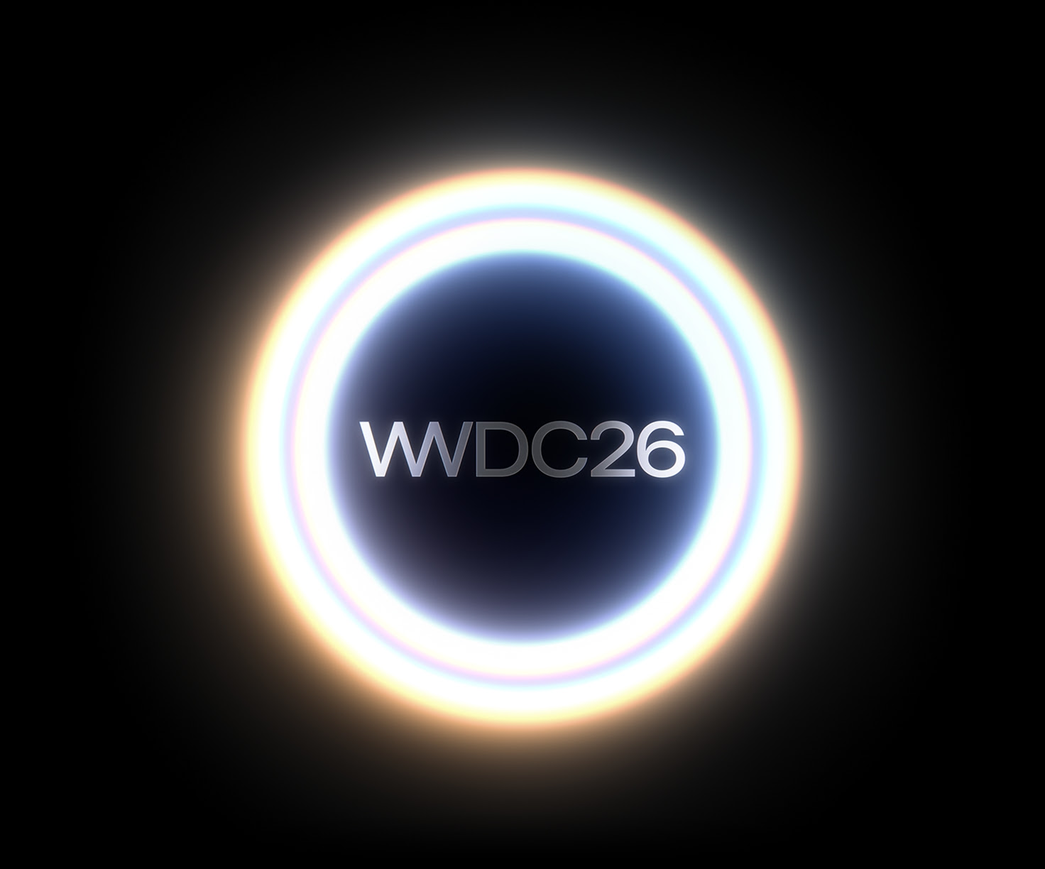 A glowing white double circle with “WWDC26” in the middle.