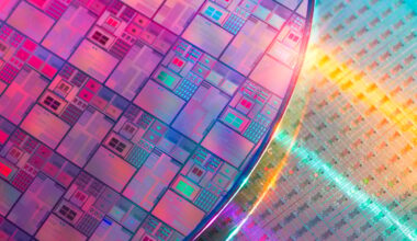 Two silicon wafers etched with circuits.