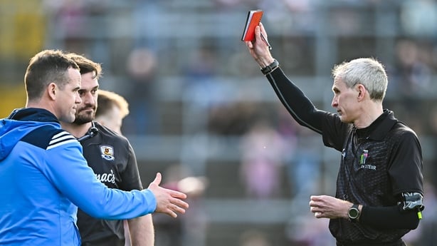 22 March 2026; Referee Fergal Kelly shows the red card to Dublin manager Ger Brennan and to Galway strength and conditioning coach Cian Breathnach McGinn before the start of the second half, during the Allianz Football League Division 1 match between Galway and Dublin at Pearse Stadium in Galway. Ph