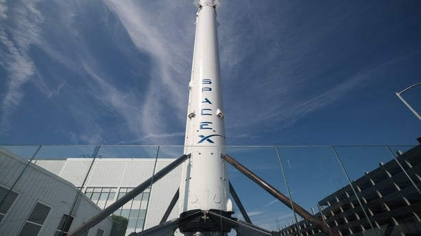 A SpaceX Falcon 9 rocket is displayed outside a Space Exploration Technologies Corp. facility in Hawthorne, California on March 26, 2026. SpaceX, the company founded by tech billionaire Elon Musk, will soon file for an initial public share offering in June that could raise a whopping $75 billion for