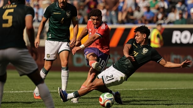HARRISON, NEW JERSEY - JUNE 06: Ché Adams #10 of Scotland shoots and scores his second goal of the game past Yomar Rocha #21 of Bolivia in the first half during an international friendly match between Scotland and Bolivia at Sports Illustrated Stadium on June 06, 2026 in Harrison, New Jersey. (Photo