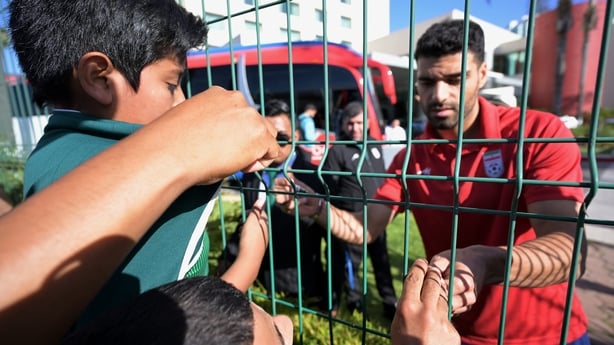 Iran's forward Mehdi Taremi signs autographs for fans in Tijuana, Mexico