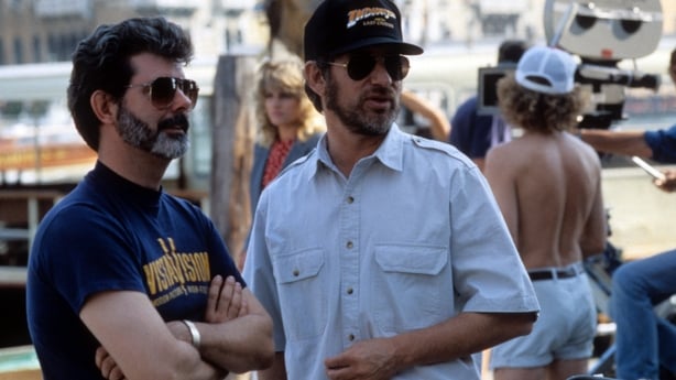 George Lucas and Steven Spielberg on set of the film Indiana Jones And The Last Crusade, 1989. (Photo by Paramount/Getty Images)