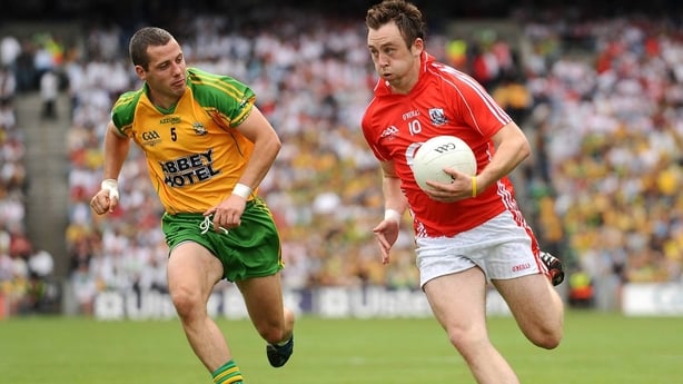 Paul Kerrigan takes on Donegal defender Barry Dunnion. The Nemo Rangers forward ended with a tally of 1-04