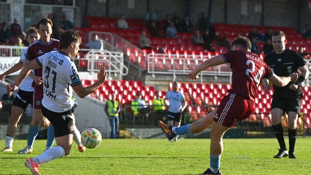 12 June 2026; Edward McCarthy of Galway United has a shot on goal blocked by John Ross Wilson of Dundalk during the SSE Airtricity Men's Premier Division match between Galway United and Dundalk at Turner's Cross Stadium in Cork. Photo by Mark Kavanagh/Sportsfile