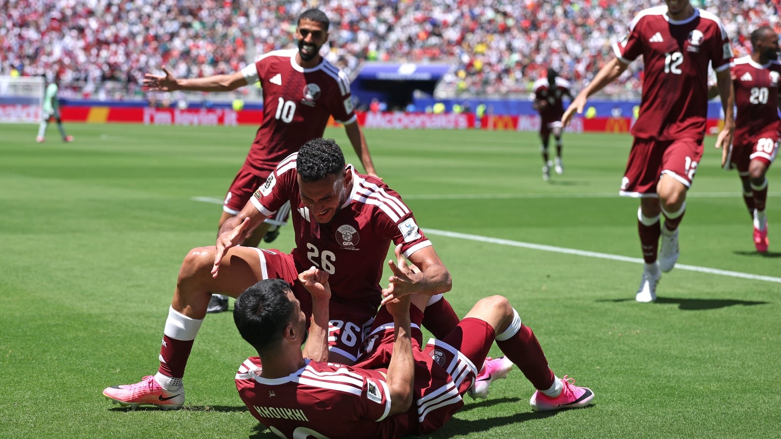 Qatar stun Switzerland with injury-time equaliser